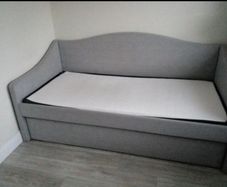 Single  bed with a mattress and pull-out guest bed