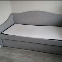 Single  bed with a mattress and pull-out guest bed