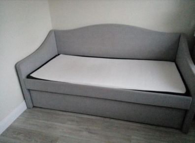 Single  bed with a mattress and pull-out guest bed