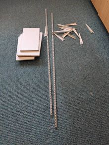 Steel shelving brackets and shelves