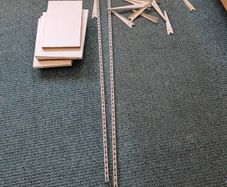 Steel shelving brackets and shelves