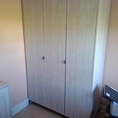 Three-door wardrobe in light wood effect finish