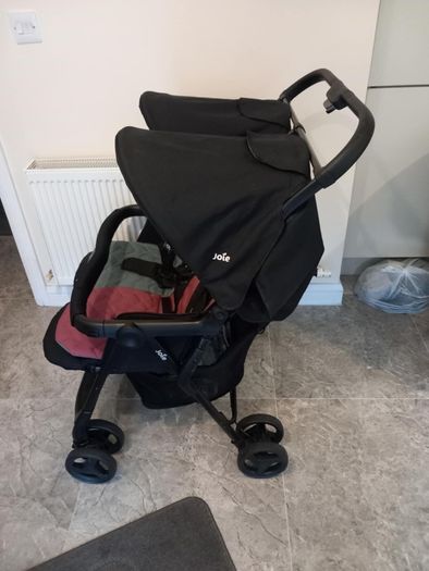 Joie double baby's buggie with rain covers