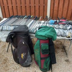 A selection of golf clubs and bags. NOT SELLING SEPARATE