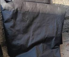 Weed membrane and leftover plastic grids for paving