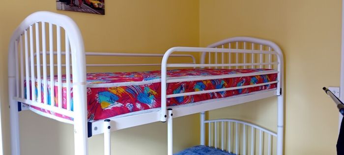 white metal bunk beds