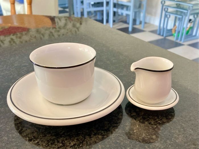 Coffee cup and cream jug