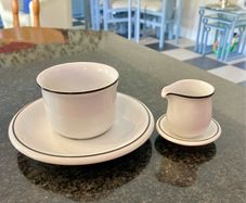Coffee cup and cream jug