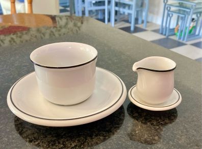 Coffee cup and cream jug