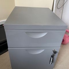Grey lockable filing cabinet on castors