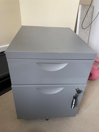 Grey lockable filing cabinet on castors