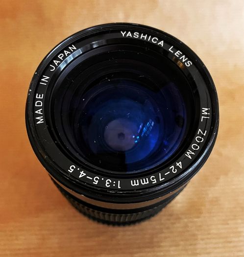 Yashica FX-D Quartz compact, manual-focus 35mm SLR film camera + 3 lenses.