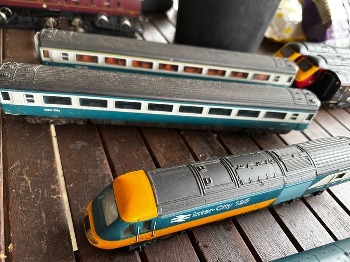 2 Hornby British rail engines and 2 British rail coaches. Don't have a controller so don't know if they work or not Hornby train