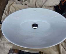 Countertop basin with countertop mounted tap