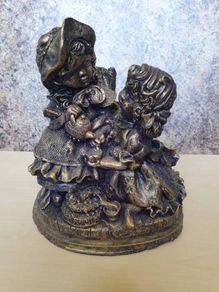 Cast concrete Two little victorian girls having tea stone statue ornament indoor conservatory porch fireplace doorstep patio black gold purple