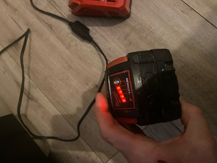 Nearly new Milwaukee M18 red 4.0 new charger pack and box