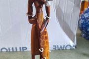 Vintage African wooden figurine of a Maasai warrior in traditional costume