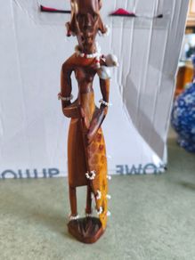 Vintage African wooden figurine of a Maasai warrior in traditional costume