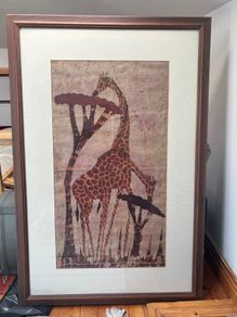 framed giraffe painting