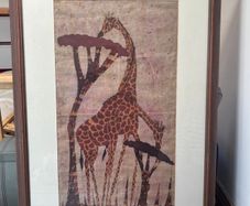 framed giraffe painting