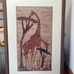 framed giraffe painting