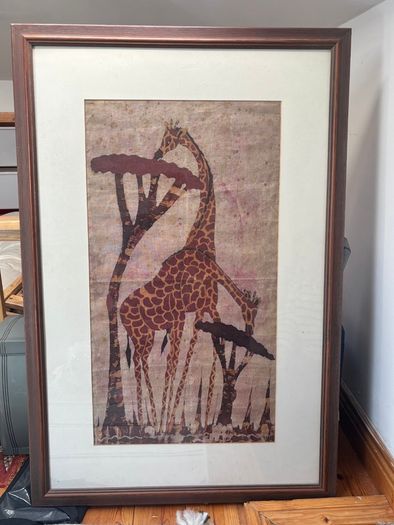 framed giraffe painting