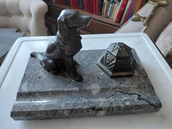Antique desk inkwell with a seated dog on marble stand