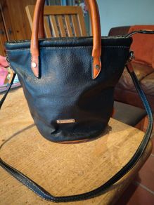 David Jones  is a classic, two-tone black pebbled Faux leather bucket bag.