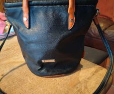David Jones  is a classic, two-tone black pebbled Faux leather bucket bag.