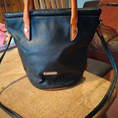 David Jones  is a classic, two-tone black pebbled Faux leather bucket bag.