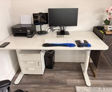 Electric sit to stand desk,chair and cabinet.