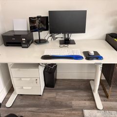 Electric sit to stand desk,chair and cabinet.
