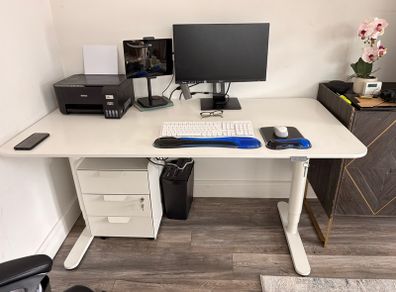 Electric sit to stand desk,chair and cabinet.