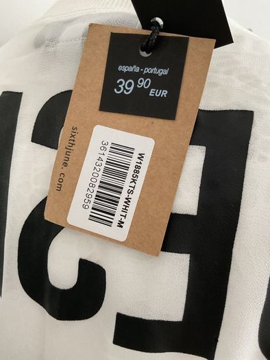long tunic with side slits Bnwt.  Short sleeve white with black logo