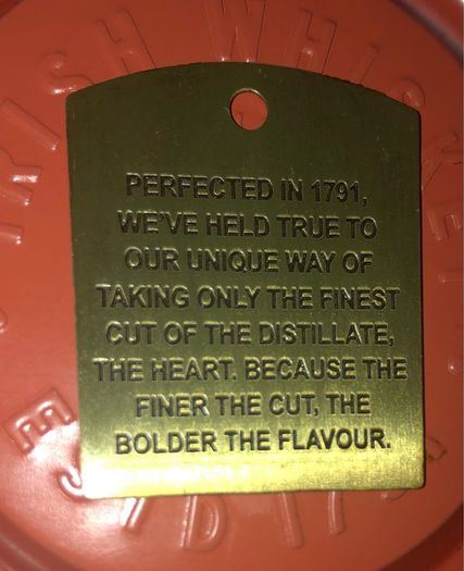 Powers whiskey medal