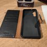 Black Multi functional phone case.  New in box. Image 6