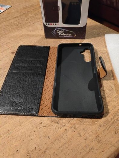 Black Multi functional phone case.  New in box.
