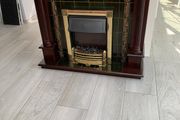 Fireplace complete with electric fire.