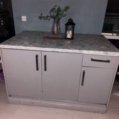 kitchen island and two stools