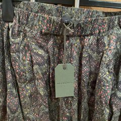 ALL SAINTS tags on khaki green snake print cuffed trousers