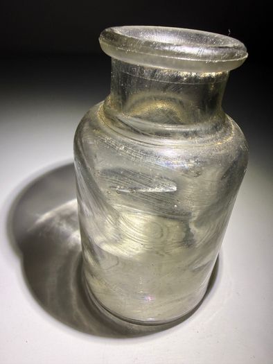 Old clear small glass jar