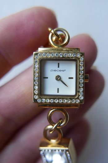 Pieces gold tone bracelet watch with crystal detail