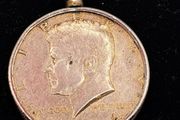 1964 Kennedy half dollar coin in a mounted pendant