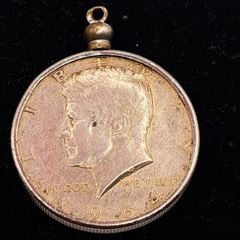 1964 Kennedy half dollar coin in a mounted pendant