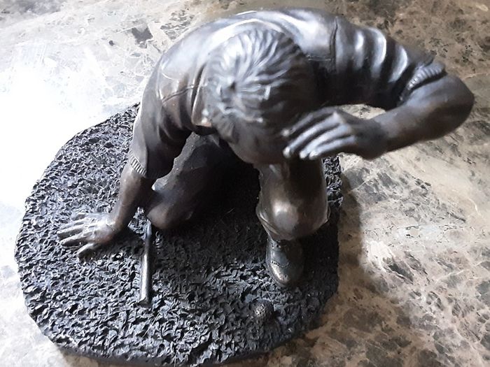 Adonis golfing figure
