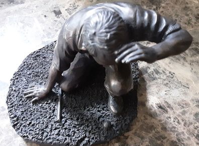 Adonis golfing figure