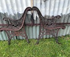 Pair of decorative cast iron bench ends