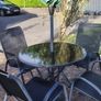 Glass table and 4 chairs. Can have umbrella and stand if want Image 3