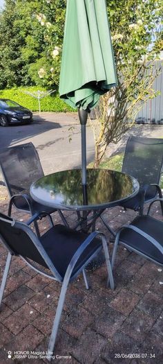 Glass table and 4 chairs. Can have umbrella and stand if want