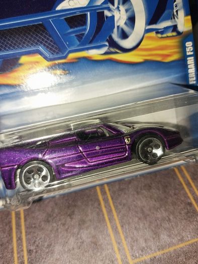 Hot Wheels Ferrari die-cast model cars from the mid-2000s and late 1990s card collections.